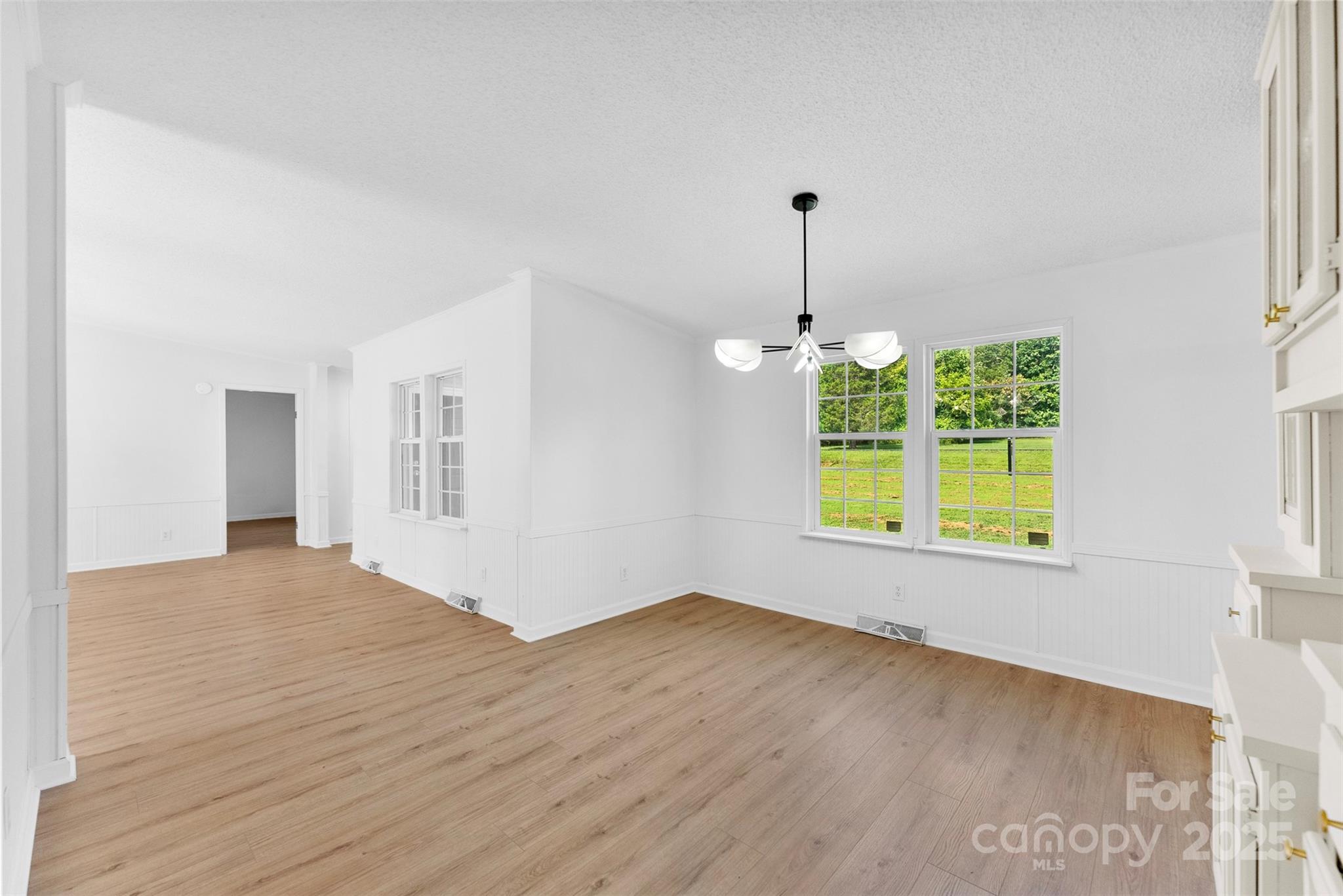 2121 Hephzibah Church Road Bessemer City, NC 28016 - Photo 9 of 41 a view of an empty room with window and wooden floor