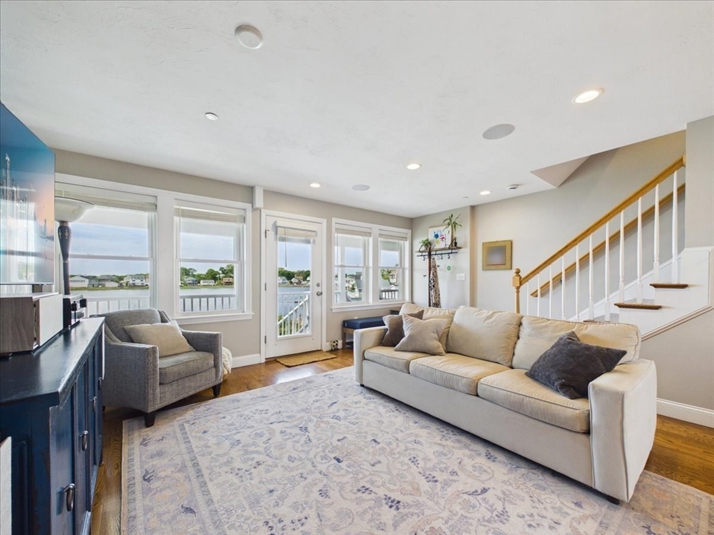 7 Bay Street, Unit 3 Hull, MA 02045 - Photo 4 of 40 a living room with furniture and a large window