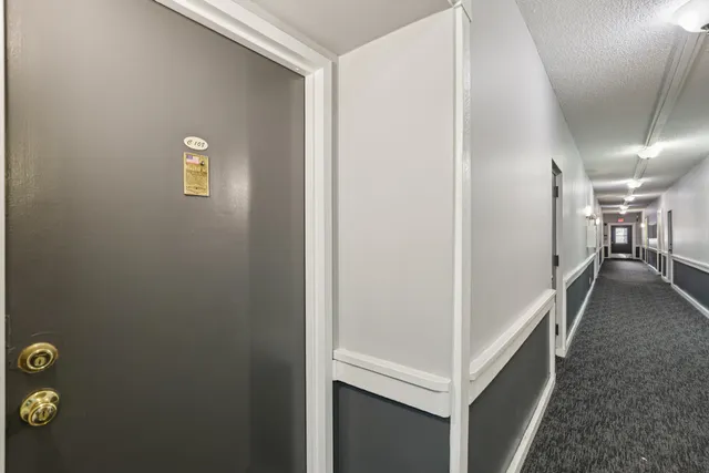 a view of an entryway with workspace and lots of stuff