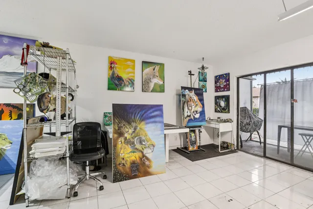 a kitchen with stainless steel appliances a white refrigerator stove and white cabinets