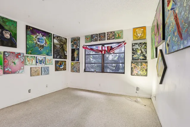 a view of room with window and cabinet