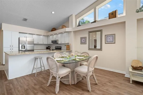a view of kitchen with cabinets and wooden floor