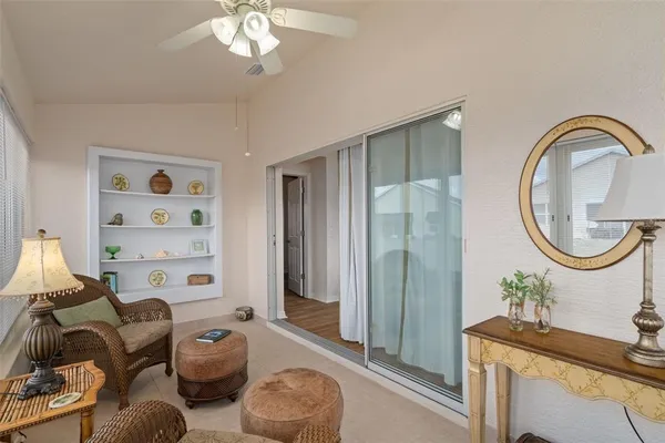 a living room with furniture a table and decor