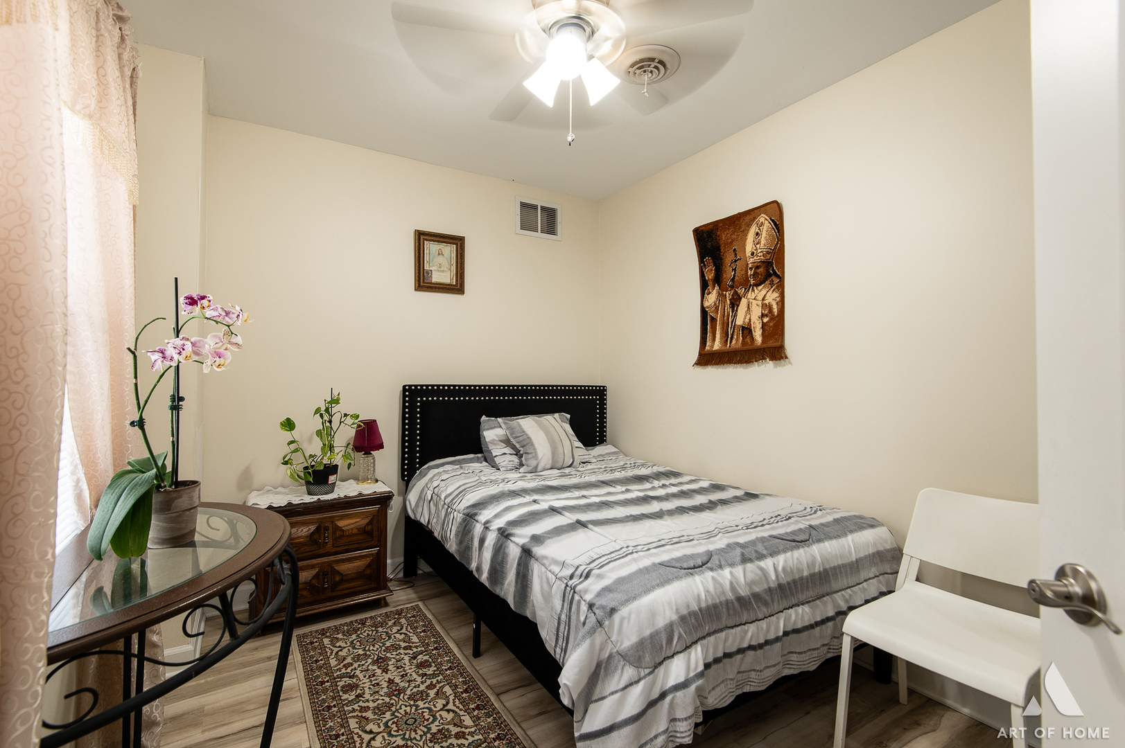3115 Maple Street Franklin Park, IL 60131 - Photo 15 of 28 a bedroom with a bed and a chandelier