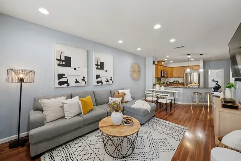 a view of a dining room with furniture and wooden floor
