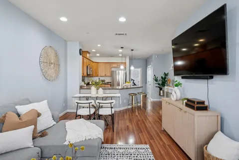 a kitchen with refrigerator a sink and a cabinets
