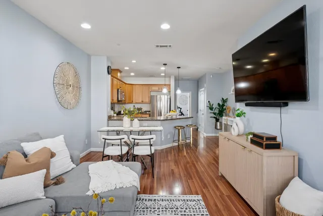 a kitchen with refrigerator a sink and a cabinets