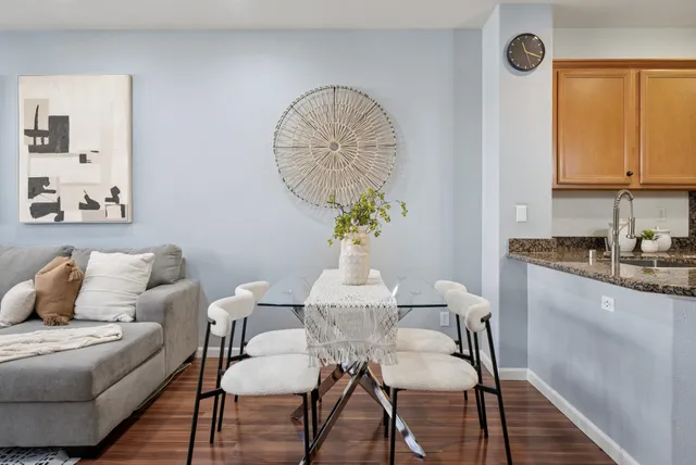 a room with kitchen island a sink a stove and a refrigerator