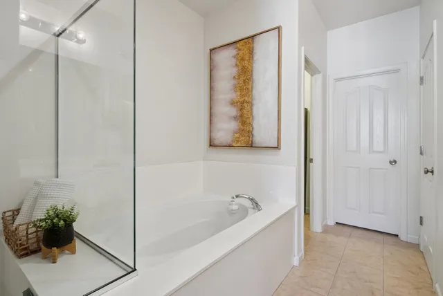 a bedroom with a bed room and flat screen tv