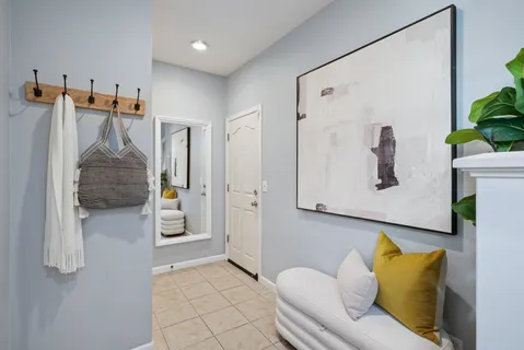 a living room with furniture and a walk in closet