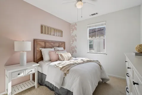 a bathroom with a sink vanity mirror and toilet