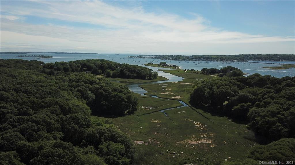 7 School House Road Stonington, CT 06355 - Photo 1 of 1 Aerial view of adjacent salt marsh showing its path to the mouth of the Mystic River and Fisher's Island Sound.