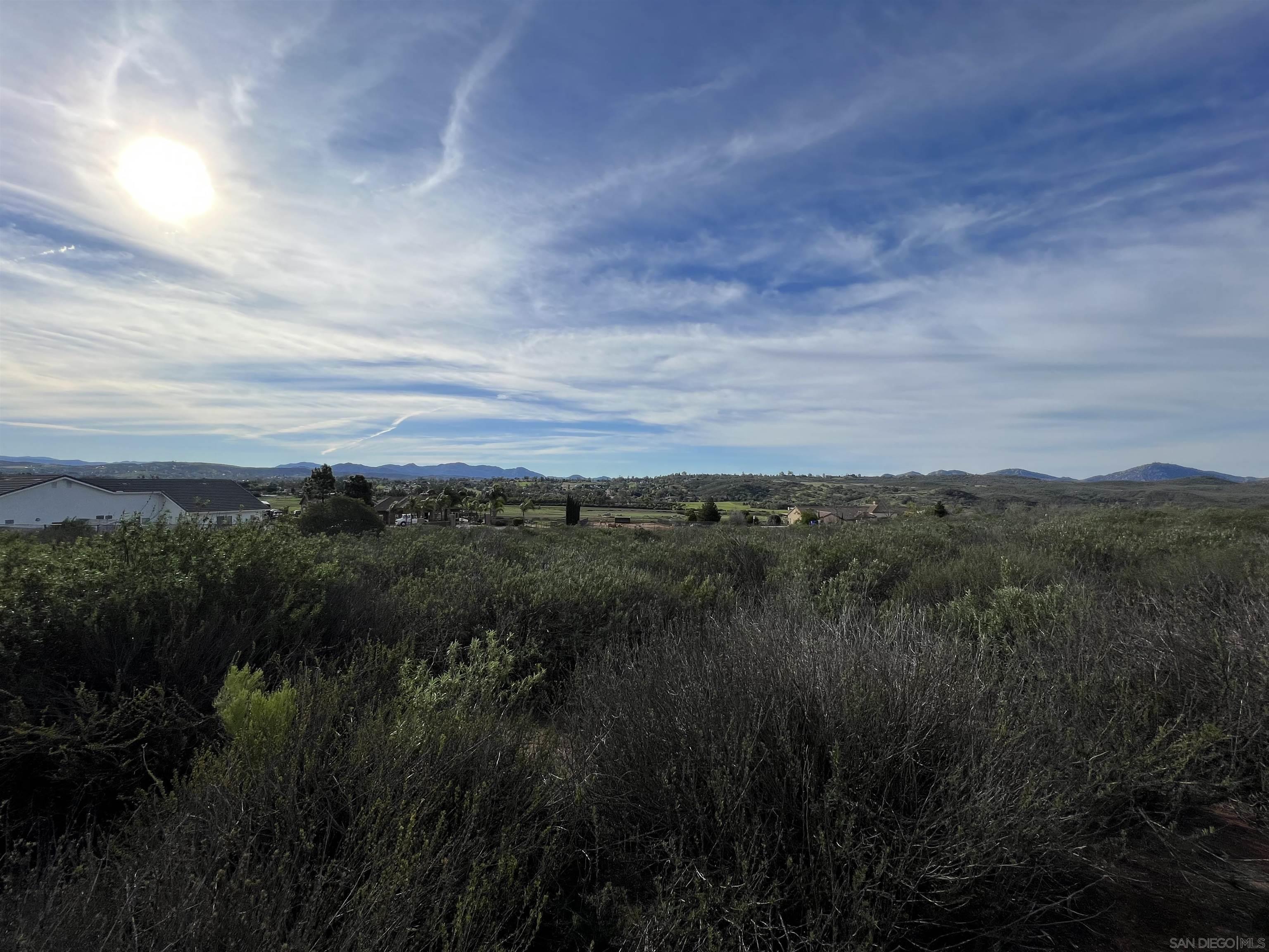 0 Quail Meadow Road Ramona, CA 92065 - Photo 8 of 26 a view of a lake and green valley