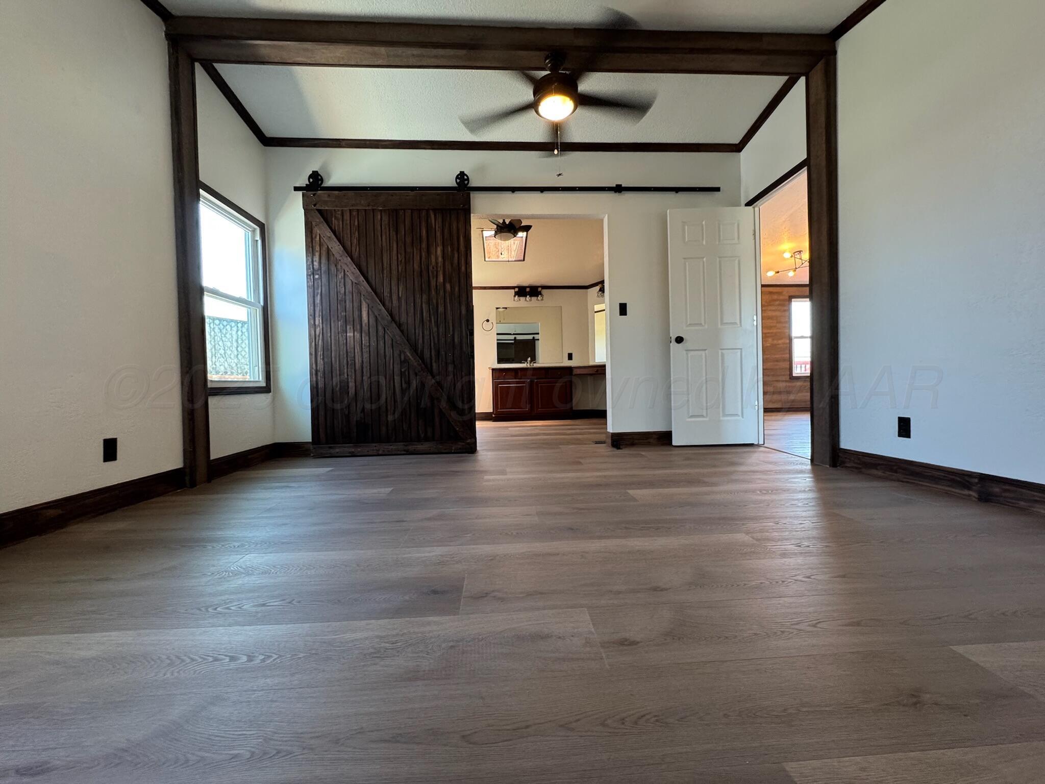 403 Aaron Road Fritch, TX 79036 - Photo 15 of 31 a view of a livingroom with wooden floor