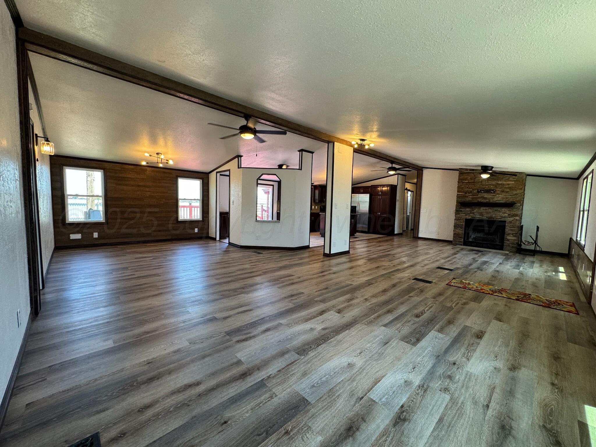403 Aaron Road Fritch, TX 79036 - Photo 2 of 31 a view of a hall with wooden floor and a window
