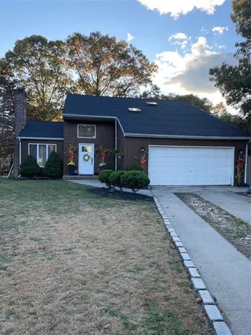 front view of a house with a yard