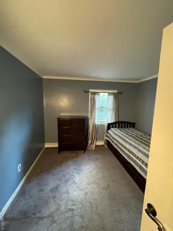 a view of bedroom and bedroom with furniture