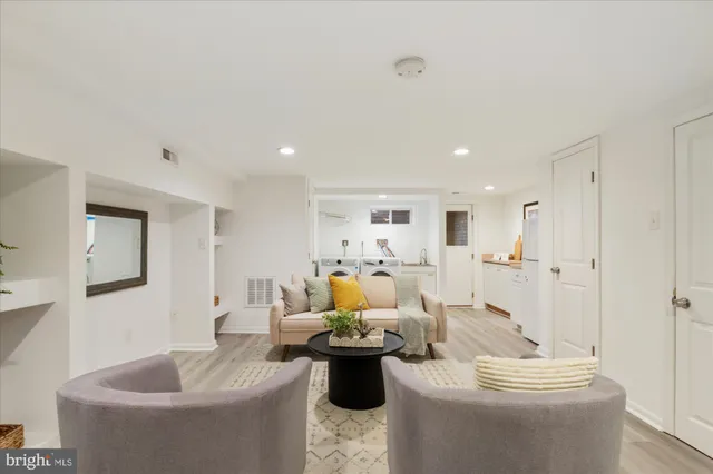 a living room with furniture and a table