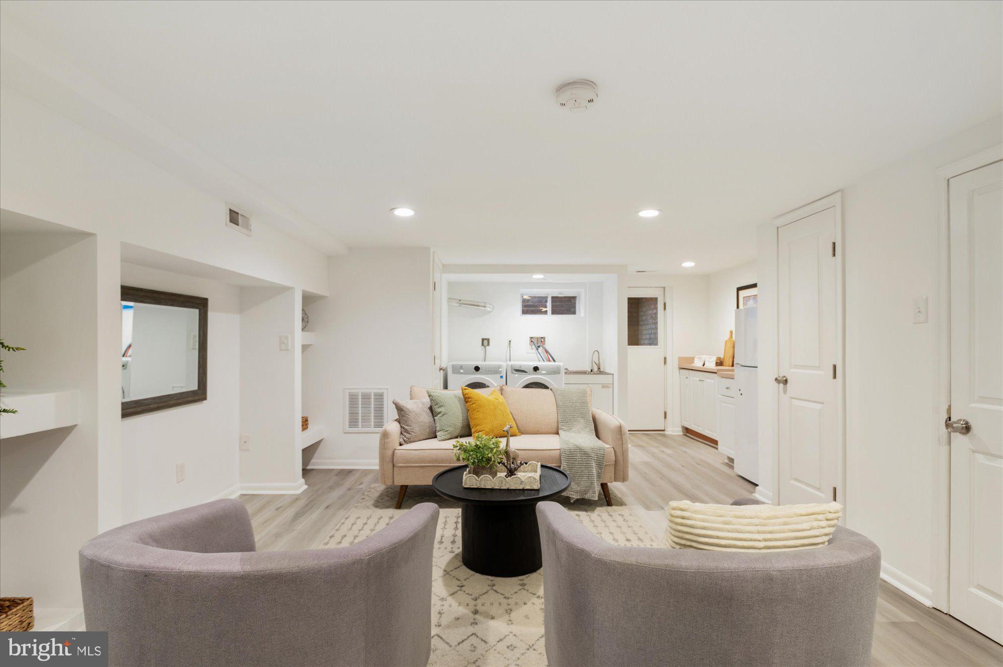 5049 North Capitol Street Northeast Washington, DC 20011 - Photo 13 of 20 a living room with furniture and a table