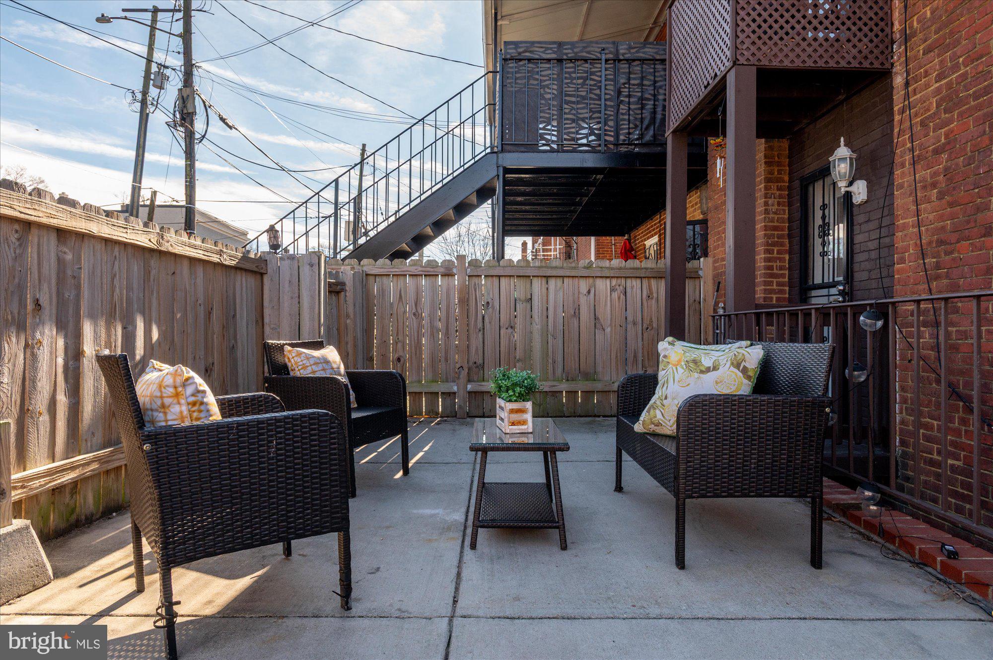 5049 North Capitol Street Northeast Washington, DC 20011 - Photo 16 of 20 a couple of chairs sitting in patio with wooden fence