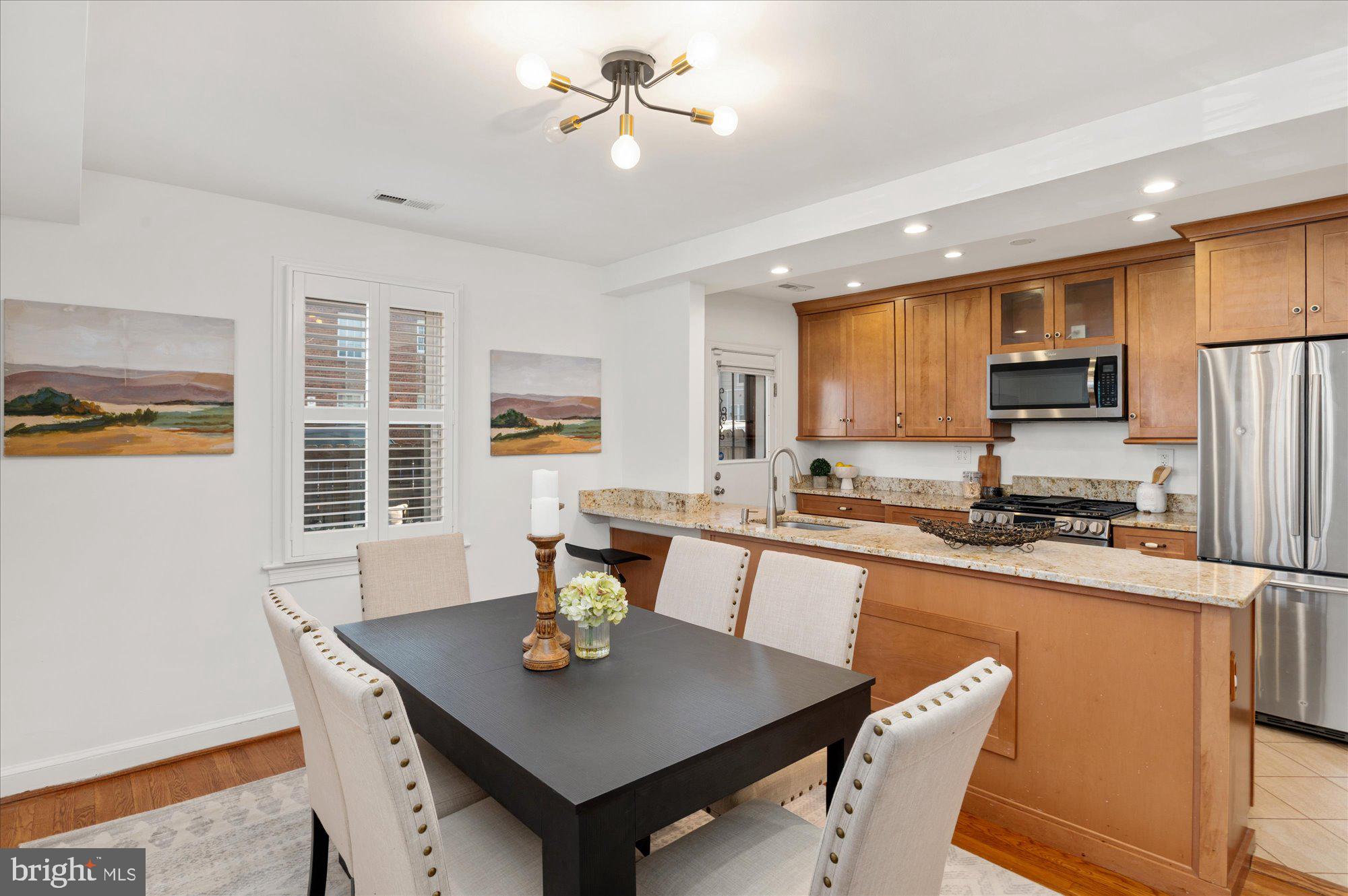 5049 North Capitol Street Northeast Washington, DC 20011 - Photo 4 of 20 a view of a dining room with furniture and a window