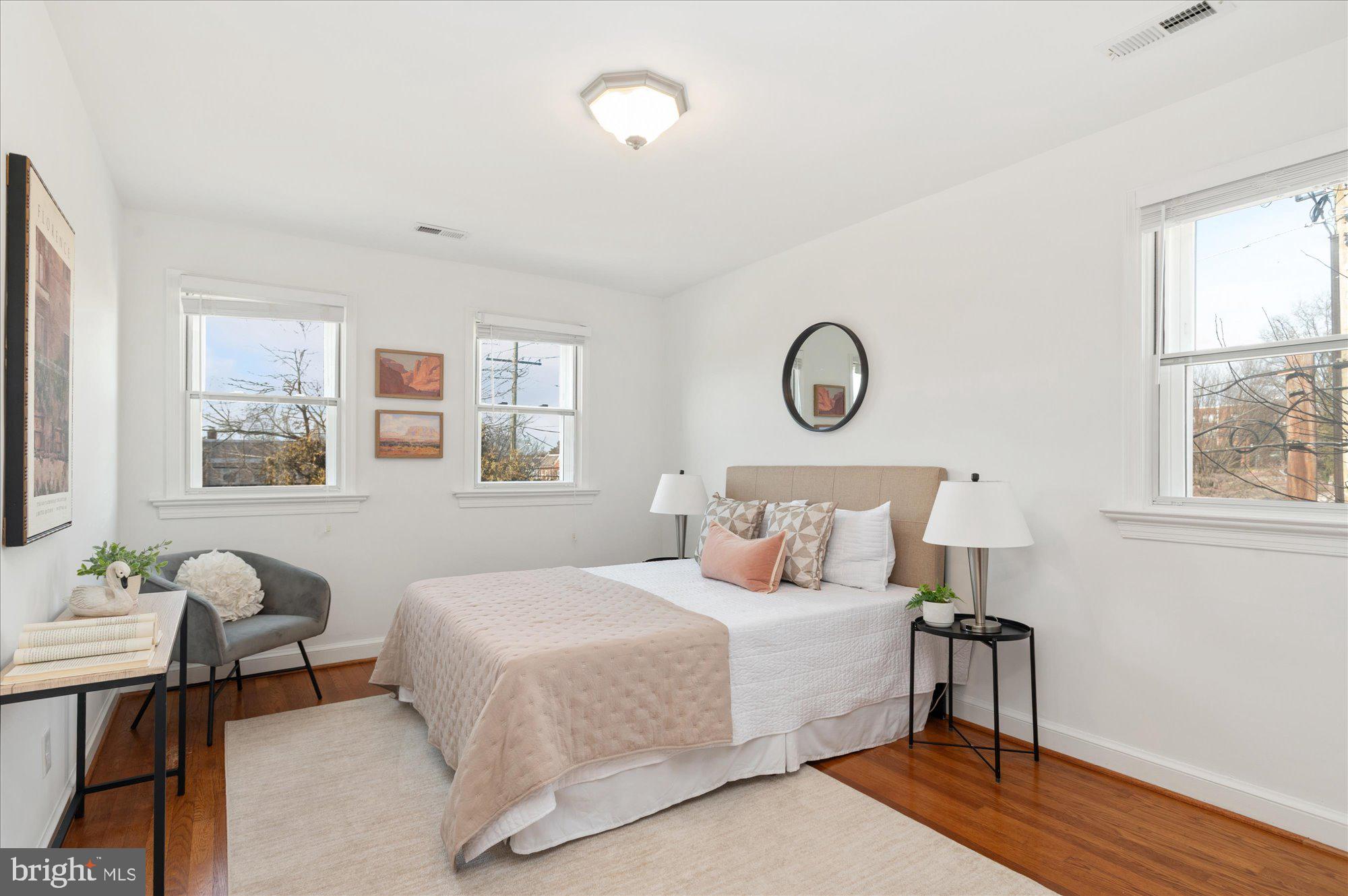 5049 North Capitol Street Northeast Washington, DC 20011 - Photo 7 of 20 a bedroom with a bed and window
