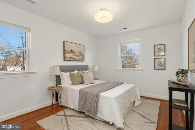 a bedroom with a bed and a table