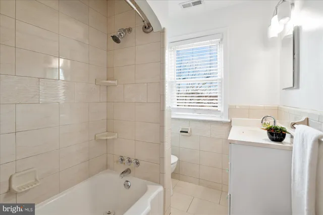 a bathroom with a bathtub a sink and a shower