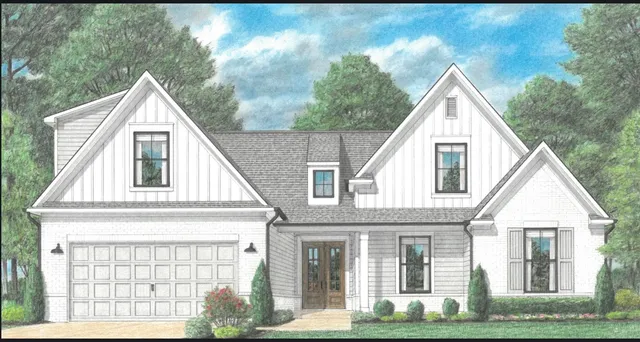 a view of a white house with large windows and a small yard