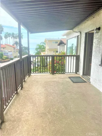 a view of porch with wooden floor