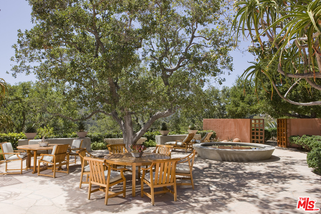 1827 Westridge Road Los Angeles, CA 90049 - Photo 13 of 34 an outdoor space with furniture and garden