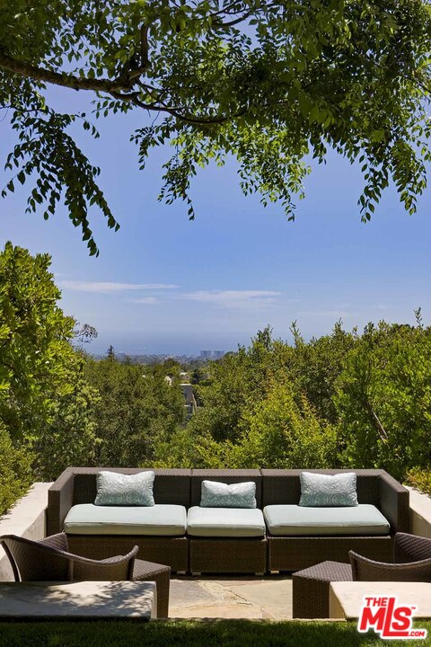 1827 Westridge Road Los Angeles, CA 90049 - Photo 34 of 34 a roof deck with couches and a fire pit