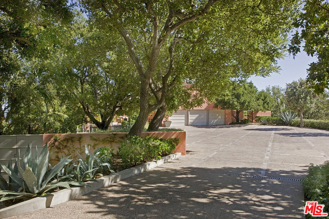 1827 Westridge Road Los Angeles, CA 90049 - Photo 7 of 34 a view of a street with a tree