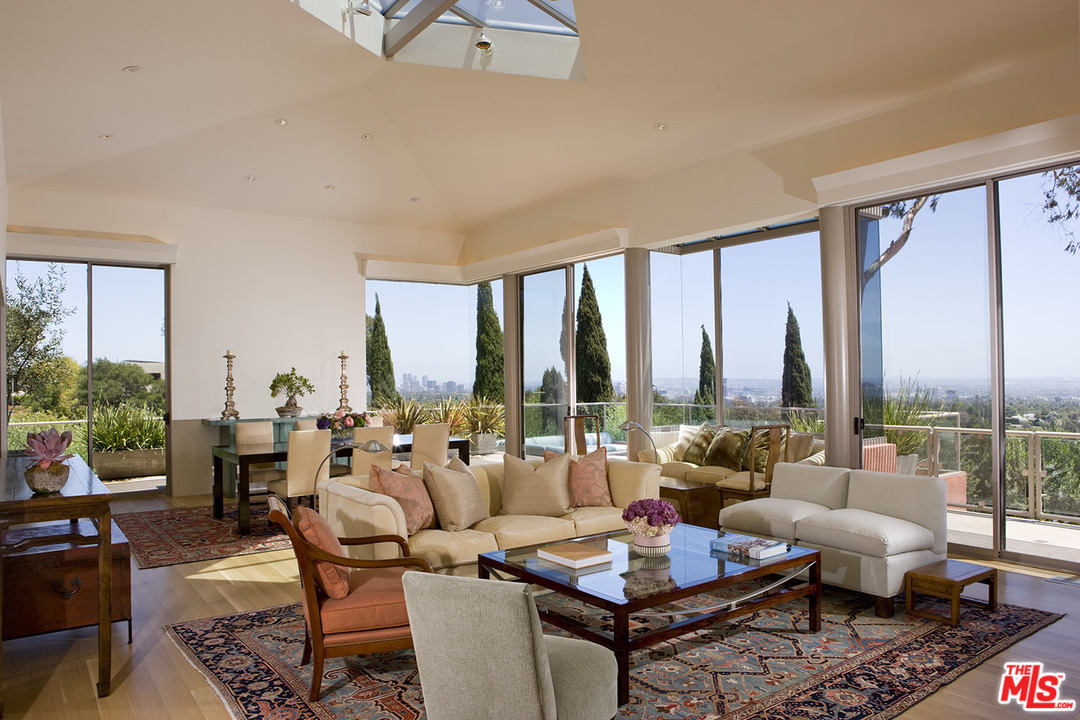 1827 Westridge Road Los Angeles, CA 90049 - Photo 9 of 34 a living room with furniture and a large window