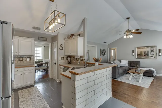a view of living room with granite countertop furniture and fireplace