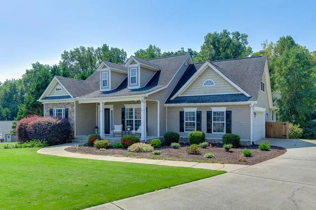 a front view of a house with garden