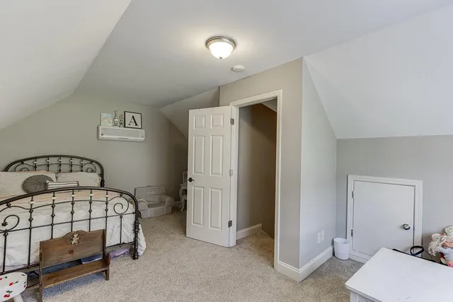 a living room with furniture gym equipment and a baby crib
