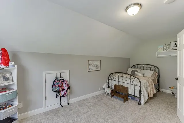 a spacious bathroom with a mirror and a sink