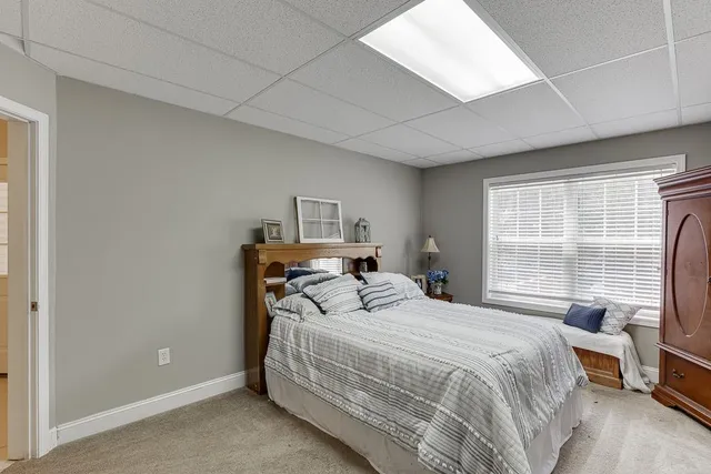 an outdoor sitting area with furniture and wooden deck