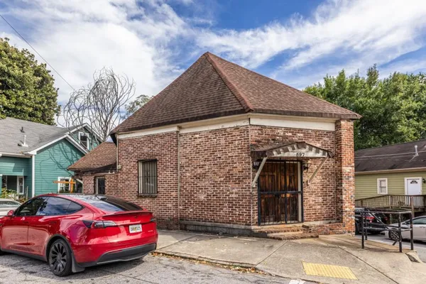 a car parked in front of a house