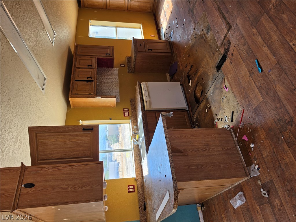 4231 West Wilson Road Pahrump, NV 89048 - Photo 3 of 19 Ample wooden cabinetry and a functional layout offer excellent potential for a customized culinary workspace.