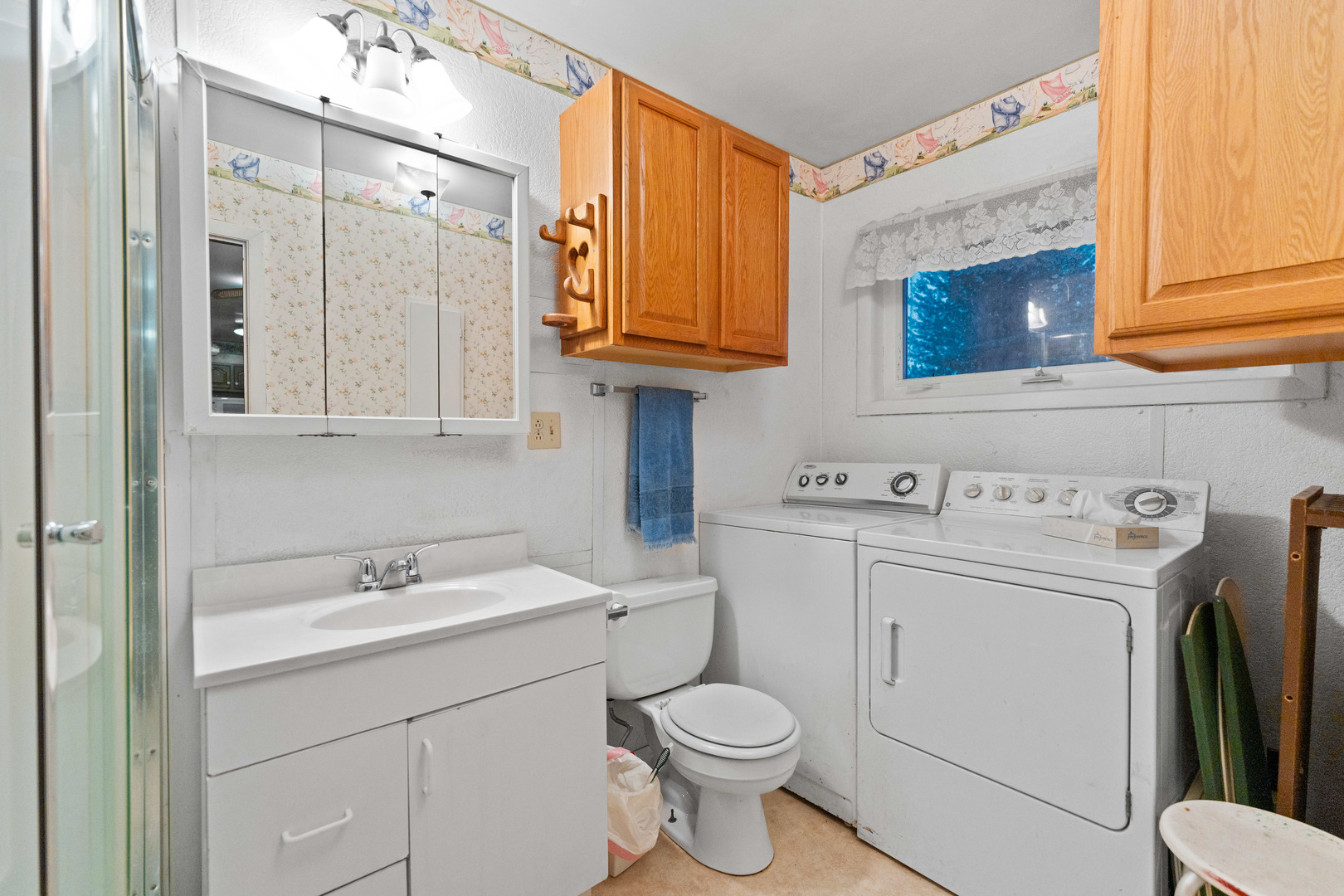 50W762 Ramm Road Maple Park, IL 60151 - Photo 11 of 37 a bathroom with a sink a toilet and a mirror