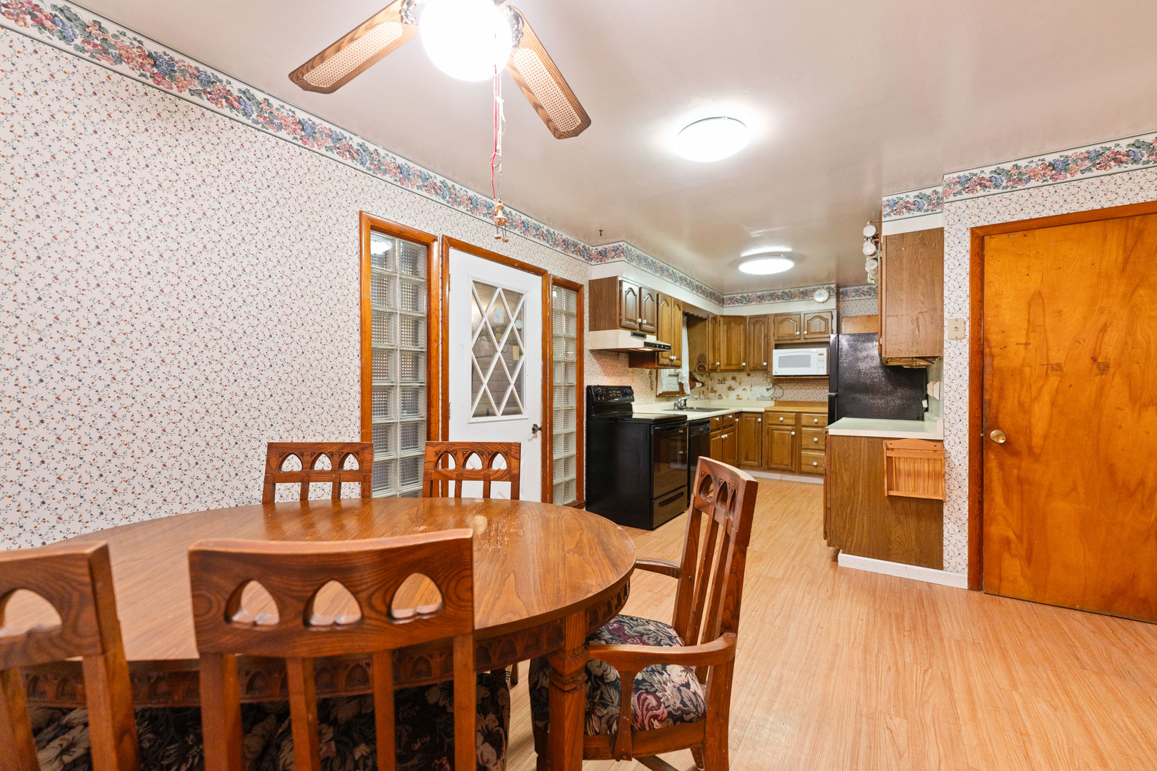50W762 Ramm Road Maple Park, IL 60151 - Photo 13 of 37 a dining room with furniture a chandelier and wooden floor