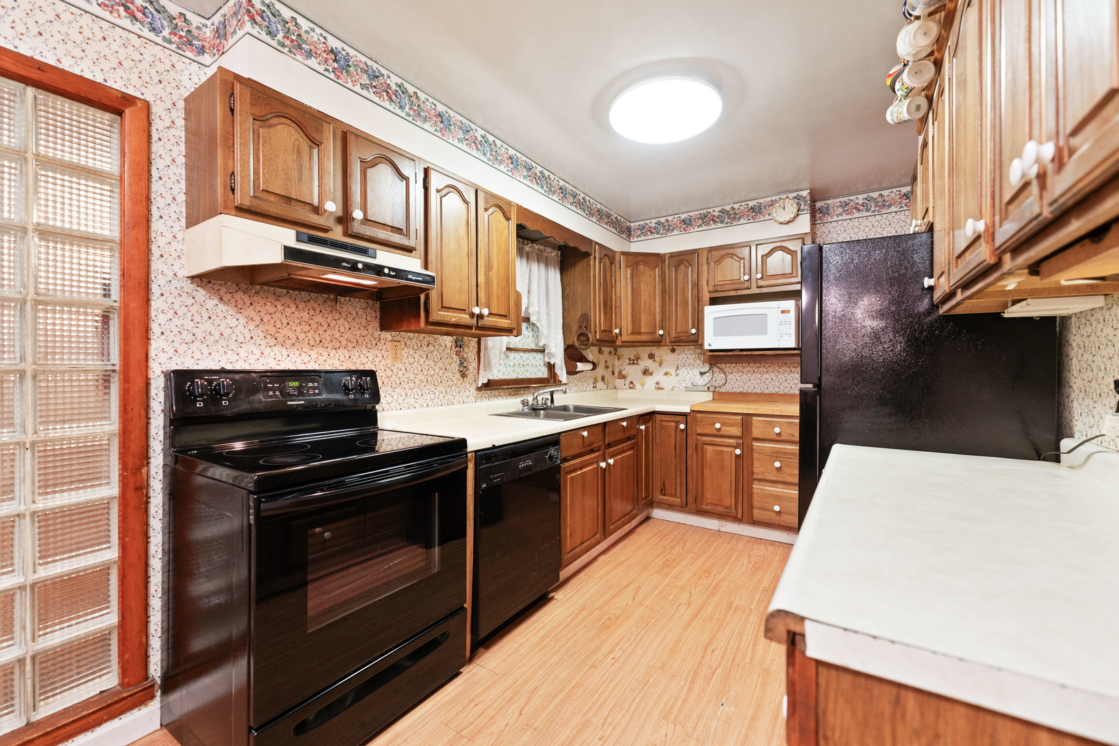 50W762 Ramm Road Maple Park, IL 60151 - Photo 15 of 37 a kitchen with stainless steel appliances granite countertop a stove a sink dishwasher and a refrigerator