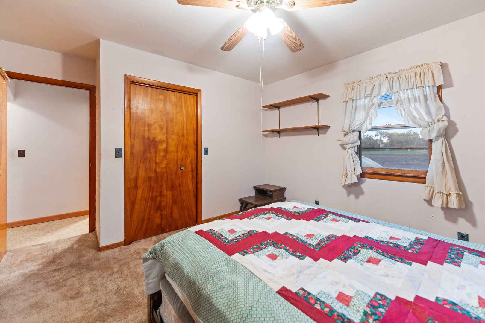 50W762 Ramm Road Maple Park, IL 60151 - Photo 17 of 37 a bedroom with a bed and a chandelier