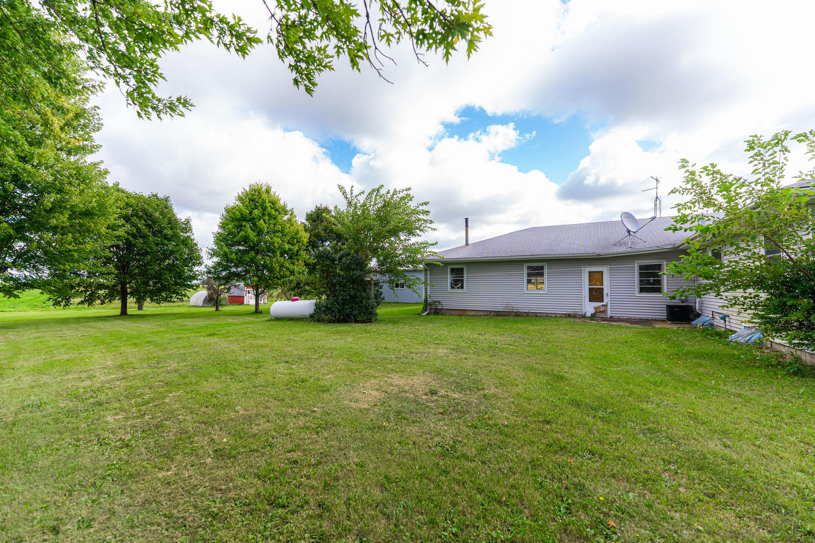 50W762 Ramm Road Maple Park, IL 60151 - Photo 29 of 37 a view of a house with a big yard potted plants and large tree