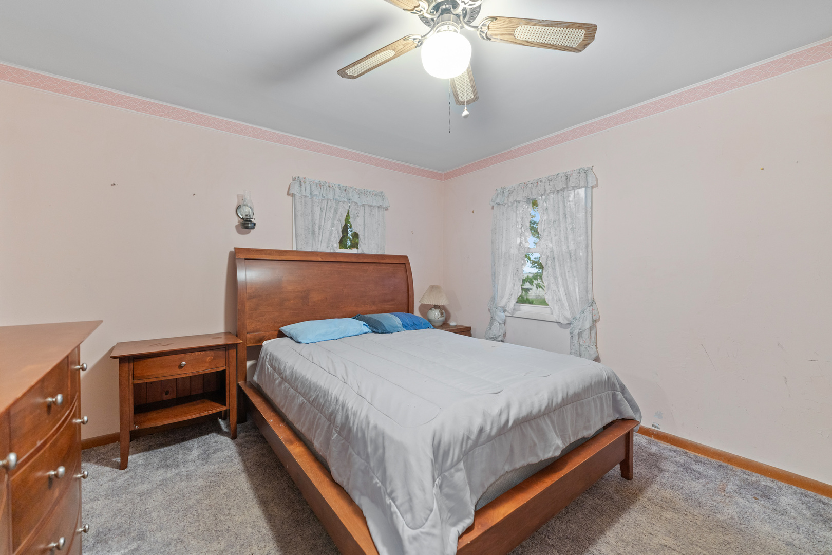 50W762 Ramm Road Maple Park, IL 60151 - Photo 6 of 37 a bedroom with a bed and a chandelier