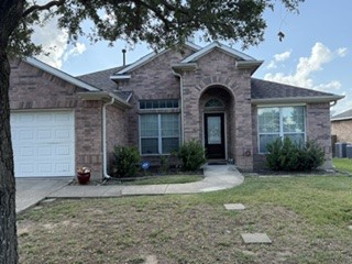 6720 Cromarty Lane Austin, TX 78754 - Photo 2 of 24 An inviting brick facade welcomes you home, complemented by a pristine driveway and an established oak tree.
