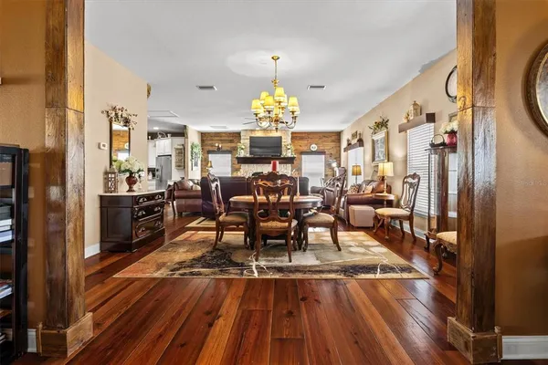 a spacious bedroom with a bed and a chandelier