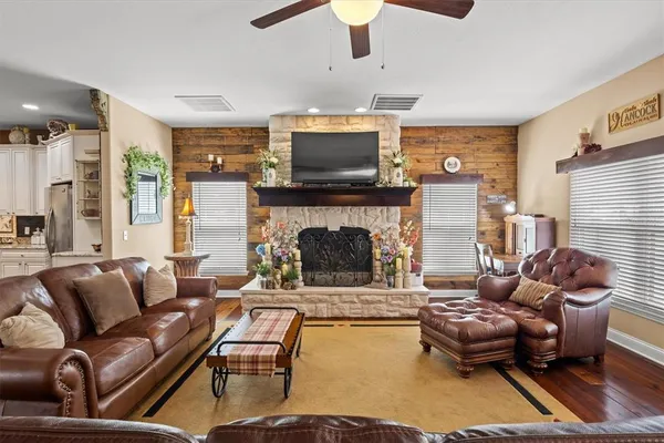 a living room with furniture and a fireplace